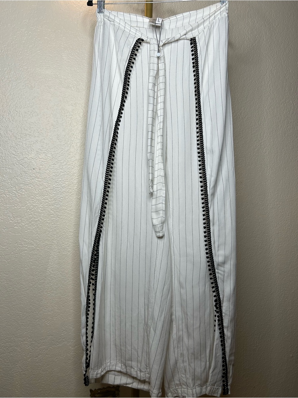 Peixoto White Pinstripe swimsuit cover up pants. Black tassels on trim details.
